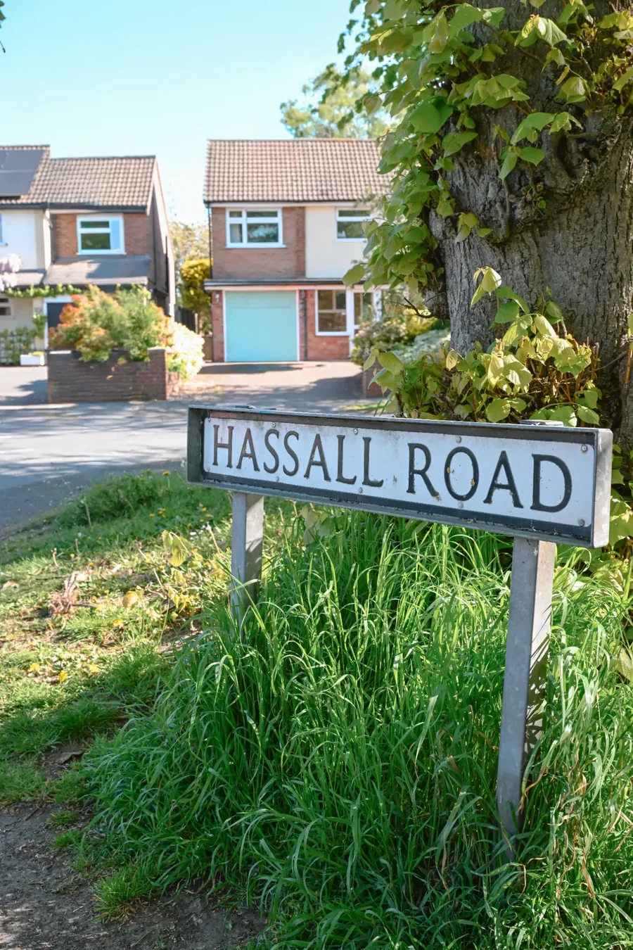 Hassall Road sign and nearby homes in Alsager, Cheshire